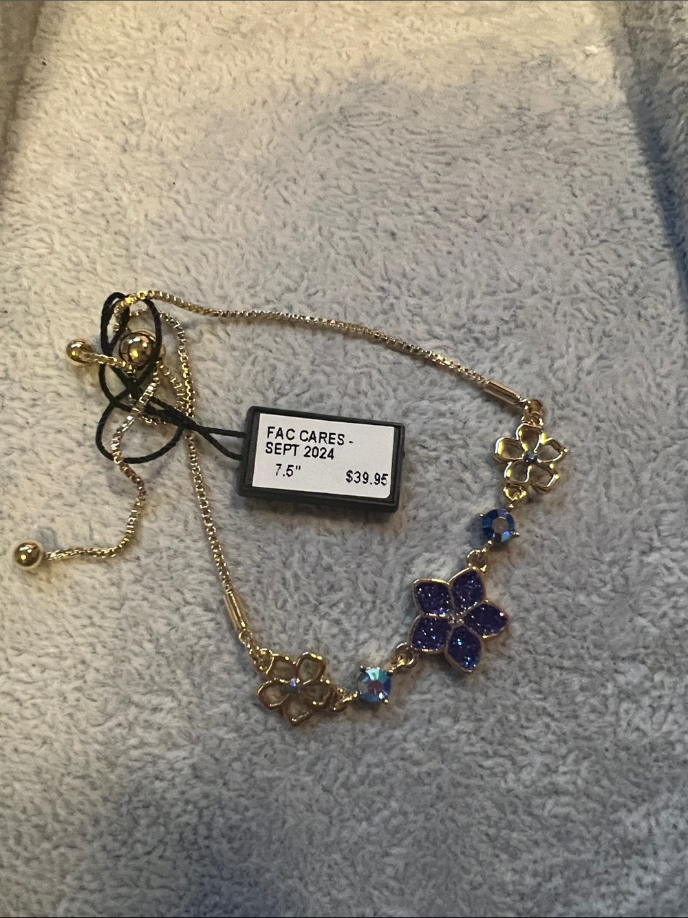 Gold-Tone Necklace with Blue Crystal Flower Accents